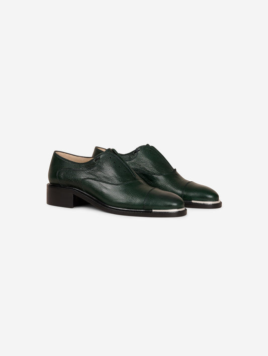 Derbies in green leather