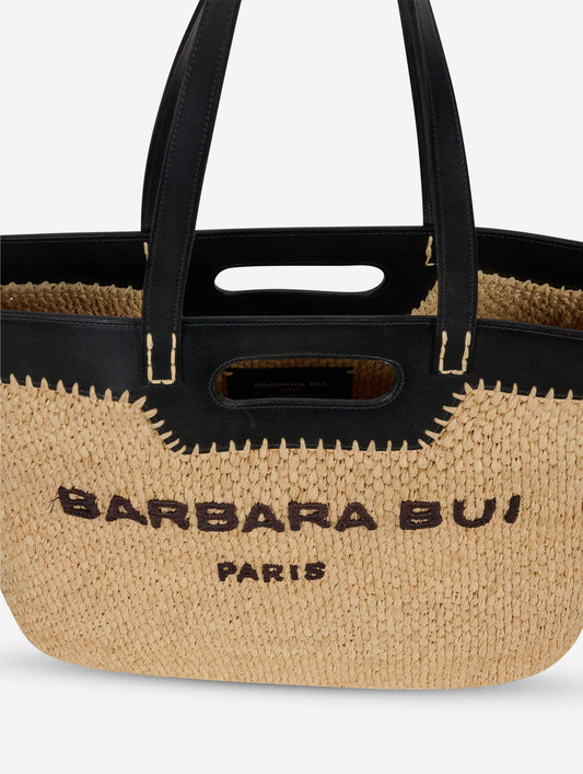Shopping bag in natural raffia and black leather