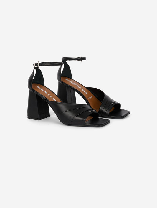 Asymmetrical black leather sandals