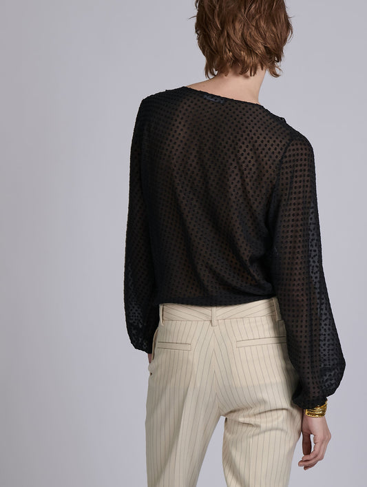 Black ruffled blouse in jacquard plumetis
