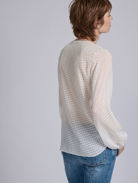 White ruffled blouse in jacquard plumetis
