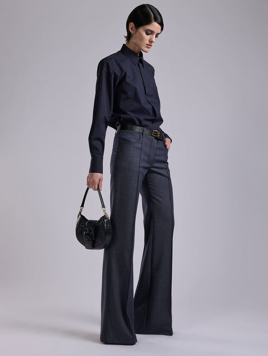 Flared Super 100 wool denim effect trousers