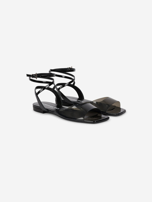 Sandales en plexi fumé et cuir verni noir
