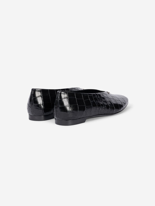 Black embossed leather ballet flats