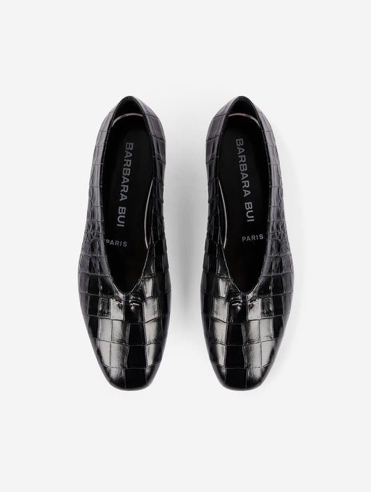 Black embossed leather ballet flats